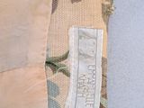 an image of a close up of a shirt with a label on it