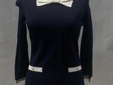 navy blue and white dress with white collared neck and cuffs