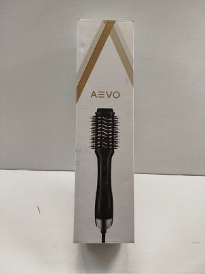 a box with a hair brush in it on a table