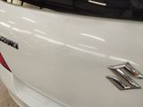a close up of the rear end of a white car