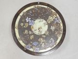 a picture of a decorative plate with flowers on it