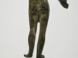 statue of a woman standing on a pedestal with her arms outstretched