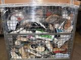 a metal cage filled with assorted items in a warehouse