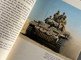 an open book with a picture of a tank on it