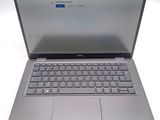 an open laptop computer sitting on top of a white table