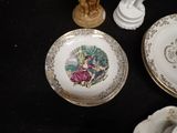 a plate with a picture of a woman on it on a table