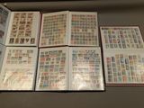 a lot of different stamps on the pages of a book