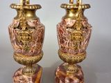 two vases sitting on top of each other on a table