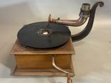 an old record player on display on a table