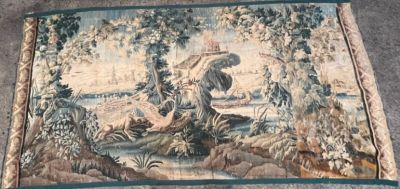 a tapestry with a picture of a man and a dog on it