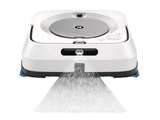 a white robot that is spraying water on the floor