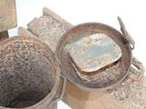 an old rusted metal bucket and a wooden box
