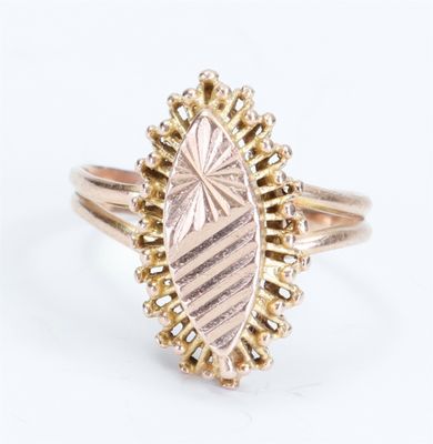 a close up of a gold ring with a diamond on it