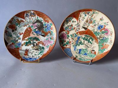 pair of chinese plates with birds and flowers painted on them