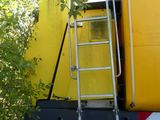 a ladder that is attached to the back of a truck