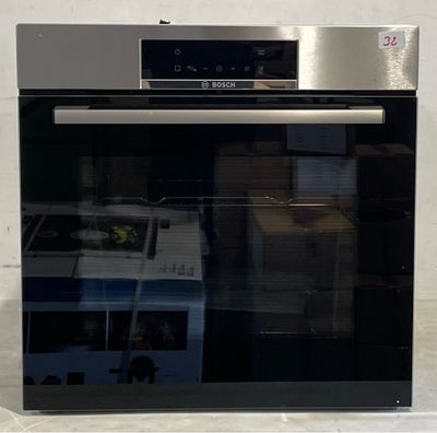 an oven that is built into the wall in the kitchen