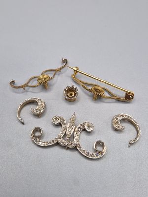 three gold and diamond brooches and a pair of earrings