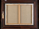 an old wooden easel with a picture frame on top of it