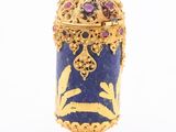 an image of a blue and gold vase with a flower decoration