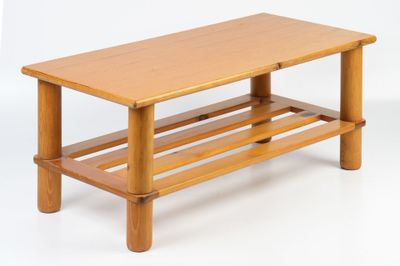 a wooden table with a shelf on top of it