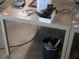 a desk with two laptops and a monitor on it
