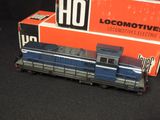 a toy train that is sitting in front of a box