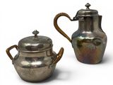 pair of antique silverplated teapots with handles and handles