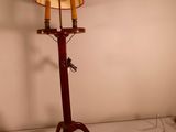 a lamp that has a red shade on top of it