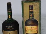 a bottle of liquor sitting next to a box of liquor