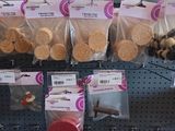 many bags of cookies on the shelf in the store