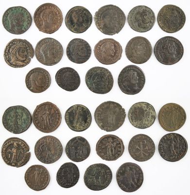 a group of old coins sitting on top of a white surface
