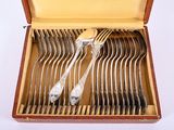 a box with a set of forks and spoons in it