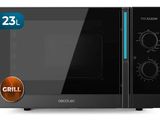 the black microwave oven is on a white background with the door open