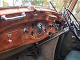 a dashboard of a car with a steering wheel and a dash board