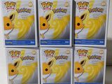 four boxes of pokemon pikachu are stacked on top of each other