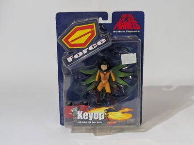 the action figure is in a plastic package on a white surface