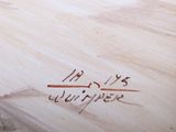 a close up of a wooden table with writing on it