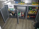 a refrigerator that has a lot of bottles of beer in it