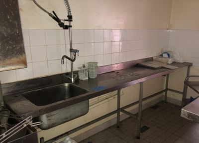 a kitchen with a sink and a sink in it