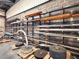 a large room with a lot of pipes and shelves