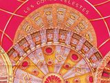 a picture of a gold and red clock on a pink background