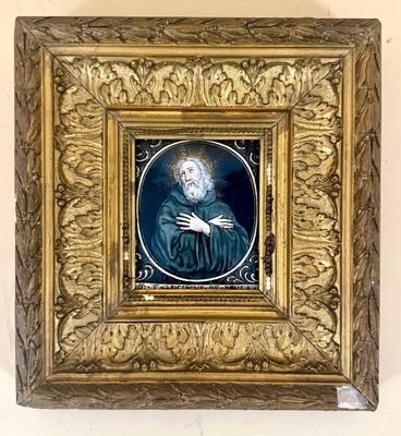 painting of a man with a beard in a gold frame on a wall