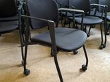 many chairs in a room with a chalkboard on the wall