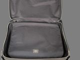 an open suitcase with a handle on a gray background