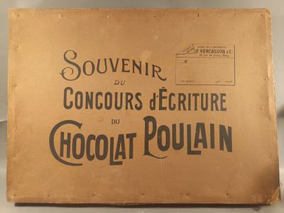an old box of chocolate sitting on top of a table