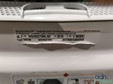 a sticker on the back of a washing machine