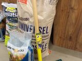 a shovel and some bags of food on the counter