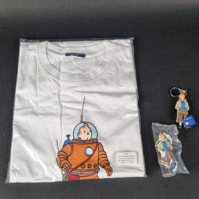 an image of a t - shirt with a picture of a man in a space suit on it and a keychain