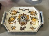 a tray with a decorative design on it sitting on a table