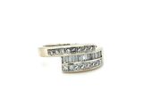 a close up of a diamond ring on a white background